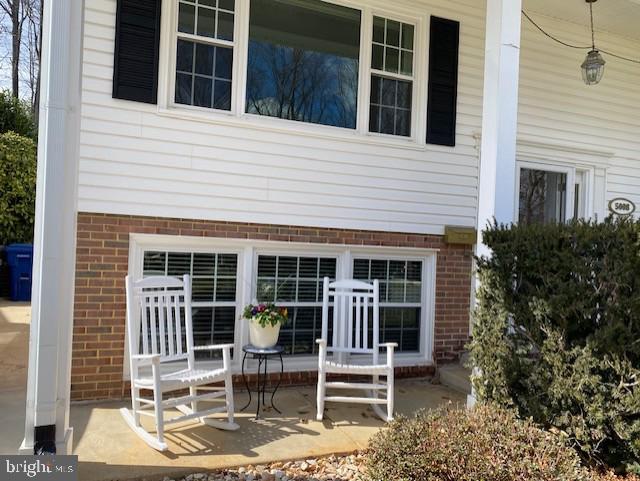 exterior space with brick siding