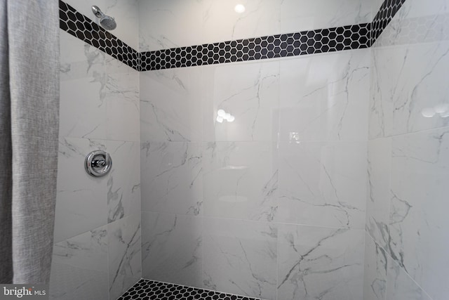 bathroom with a tile shower