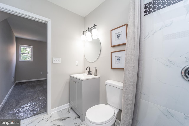 full bath with toilet, marble finish floor, baseboards, and vanity