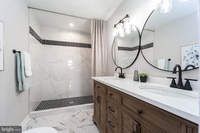 full bath with marble finish floor, double vanity, walk in shower, and a sink