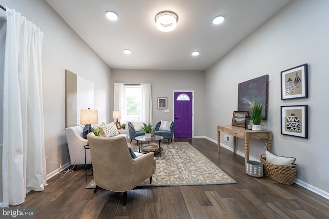 living room featuring baseboards, dark wood-style flooring, and recessed lighting