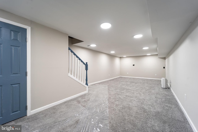 finished basement with carpet, stairs, baseboards, and recessed lighting