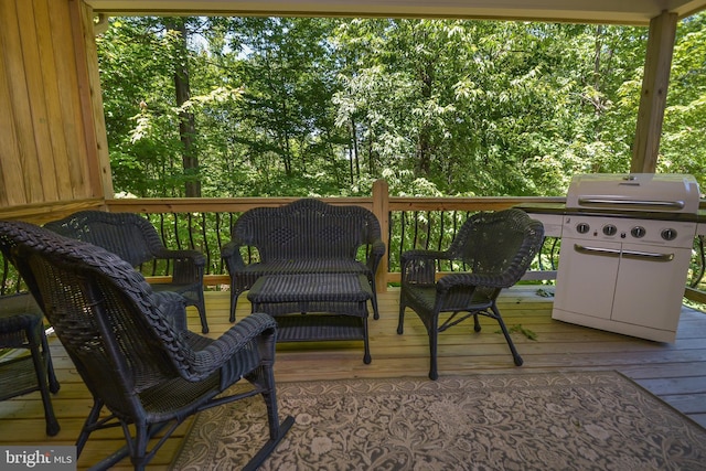 wooden terrace featuring area for grilling