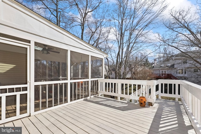 wooden terrace featuring a sunroom