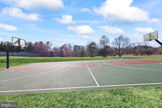 view of basketball court featuring community basketball court and a yard