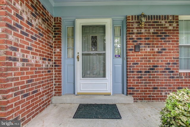 entrance to property with brick siding