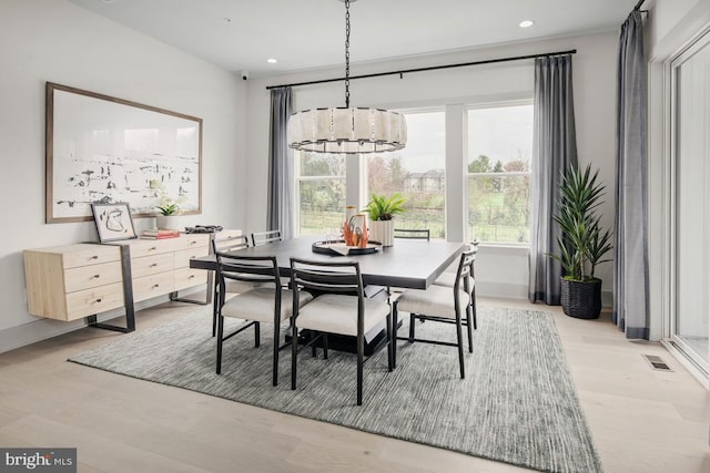 dining space with visible vents, recessed lighting, a wealth of natural light, and an inviting chandelier