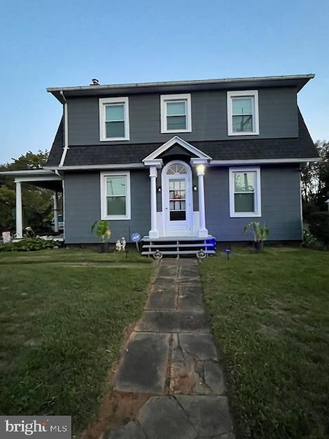 view of front of home with a front yard