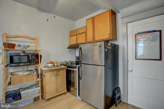 17035 Virginia Ave, Williamsport, MD 21795 - kitchen featuring appliances with stainless steel finishes, lofted ceiling, and light wood finished floors