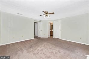 interior space with carpet and baseboards