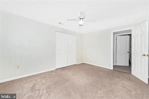 spare room with ceiling fan and carpet flooring