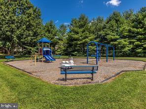 community play area featuring a lawn