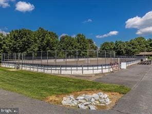 surrounding community featuring fence