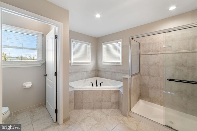 full bathroom with a stall shower, a garden tub, toilet, and tile patterned floors