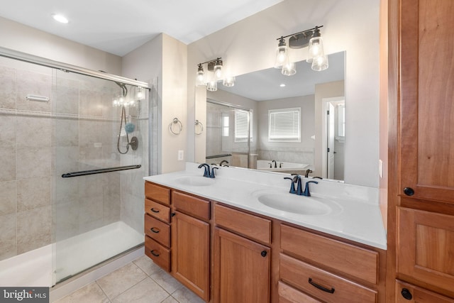 full bath featuring tile patterned flooring, a sink, a shower stall, and double vanity