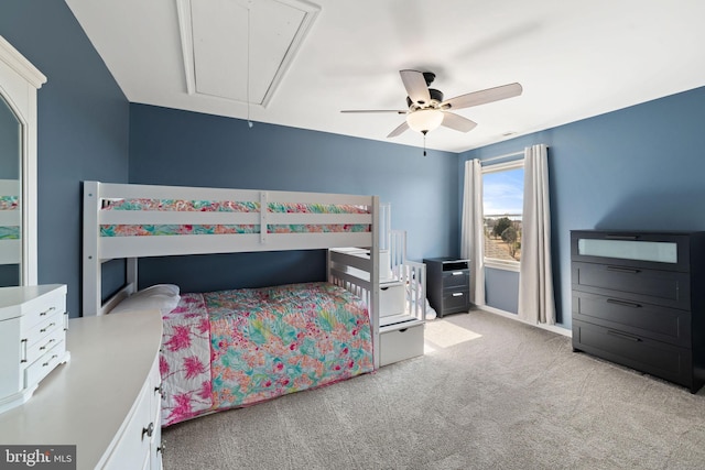 bedroom featuring ceiling fan, carpet floors, and attic access