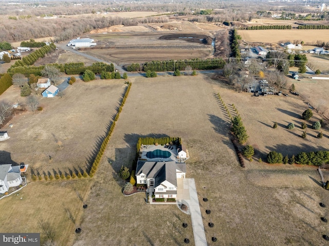 birds eye view of property with a rural view