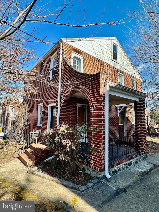 view of front of home with brick siding