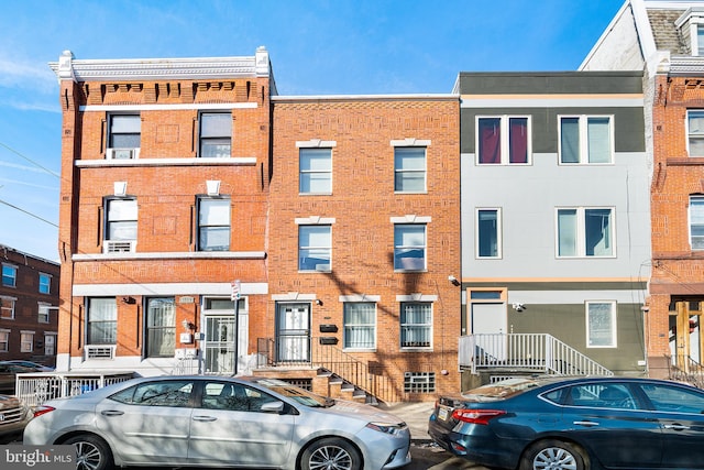 view of front of home featuring brick siding