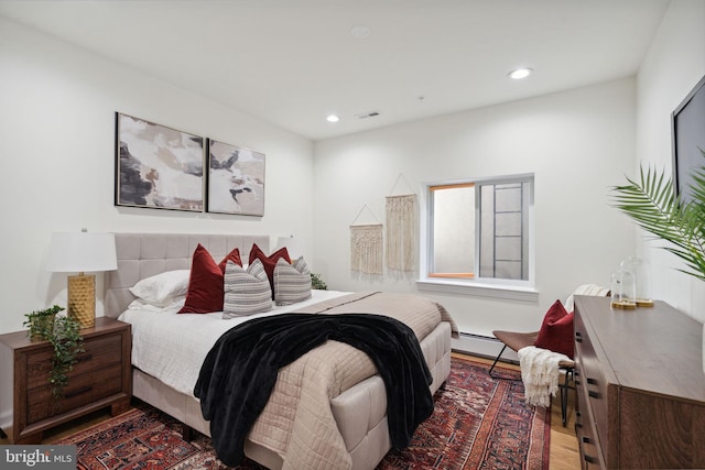 bedroom featuring recessed lighting, visible vents, and wood finished floors