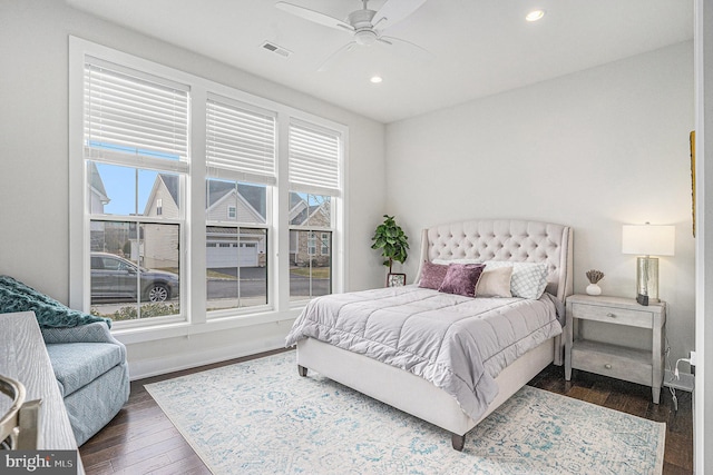 bedroom with a ceiling fan, recessed lighting, dark wood-style flooring, and visible vents