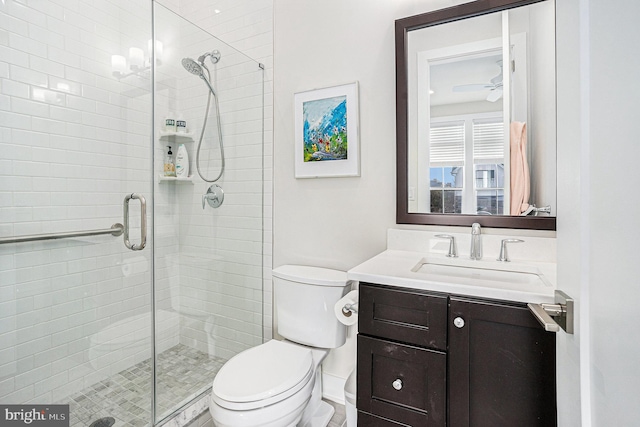 full bath with toilet, a shower stall, and vanity