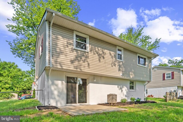 13009 Kimbrough Ln, Woodbridge, VA 22193 - rear view of property with a patio and stucco siding