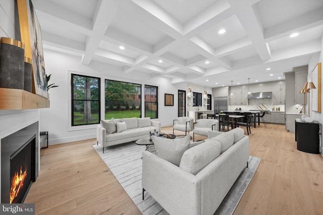 6807 29th St N, Arlington, VA 22213 - living room featuring a lit fireplace, light wood finished floors, recessed lighting, beam ceiling, and coffered ceiling