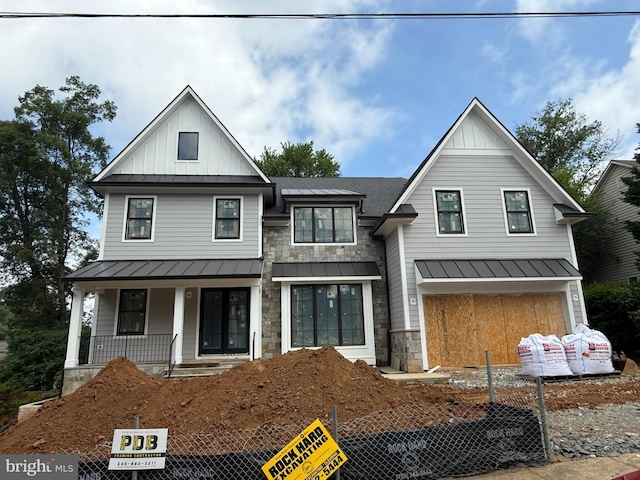 6807 29th St N, Arlington, VA 22213 - modern inspired farmhouse with a standing seam roof, board and batten siding, a porch, and a metal roof