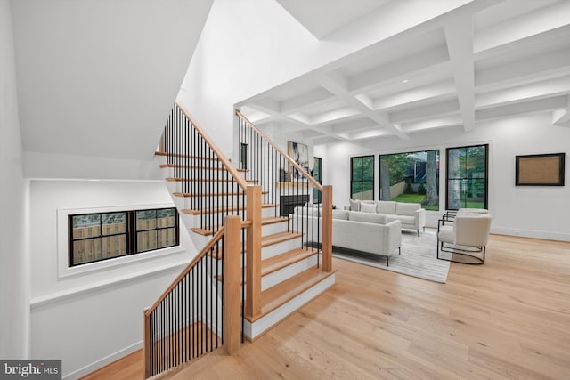6807 29th St N, Arlington, VA 22213 - stairs featuring coffered ceiling, wood finished floors, beam ceiling, and recessed lighting
