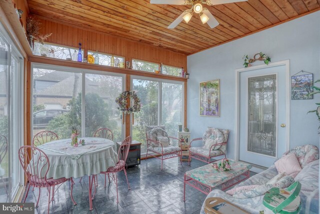 sunroom / solarium with wood ceiling and tile patterned floors
