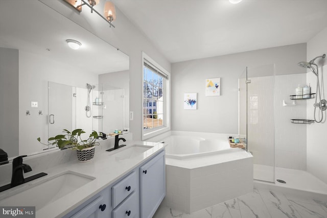 full bathroom featuring double vanity, a stall shower, a sink, and a bath