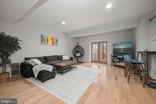 living room with french doors, recessed lighting, and light wood-style floors