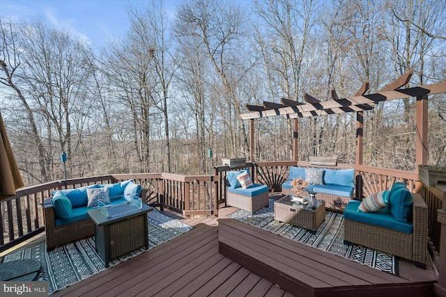 wooden terrace featuring an outdoor living space