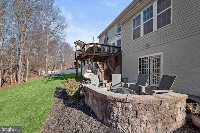 view of yard featuring a patio area, an outdoor fire pit, stairway, and a deck