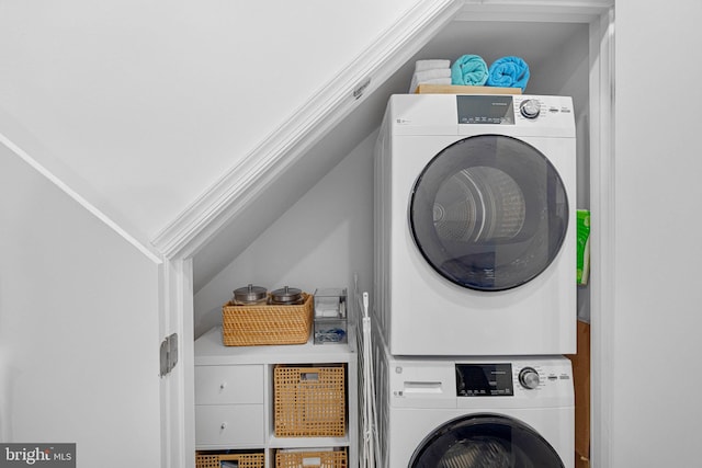 clothes washing area with laundry area and stacked washer and clothes dryer