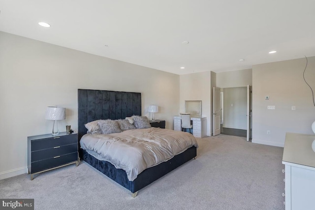 bedroom with baseboards, recessed lighting, and light colored carpet