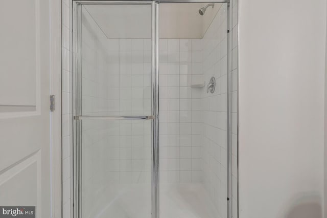 full bathroom featuring a stall shower