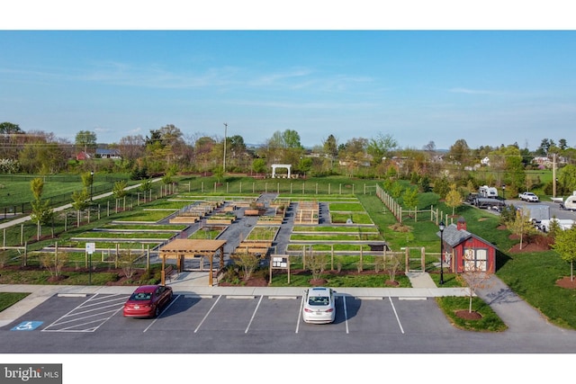 uncovered parking lot featuring fence