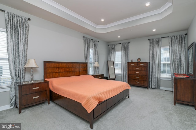 bedroom with light carpet, baseboards, a raised ceiling, crown molding, and recessed lighting