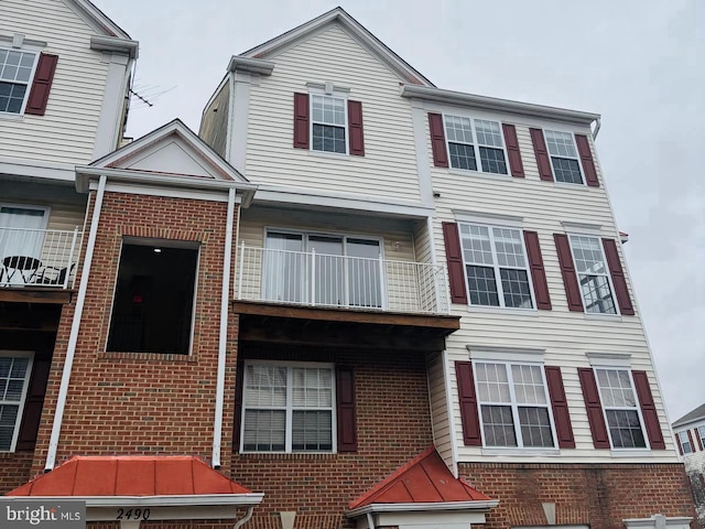 view of property with brick siding