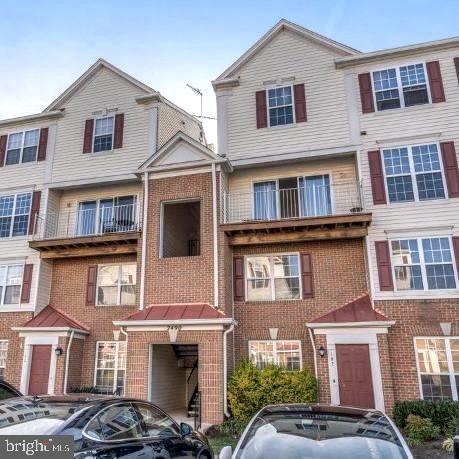 multi unit property featuring brick siding