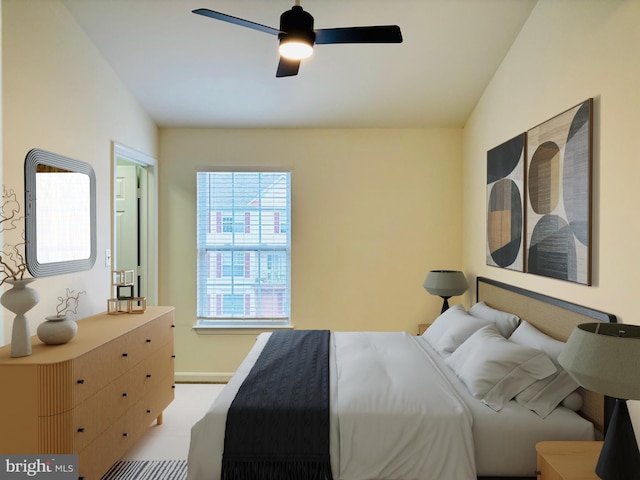 bedroom featuring ceiling fan and baseboards