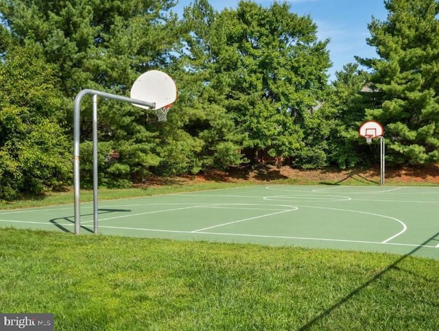 view of sport court with community basketball court and a lawn