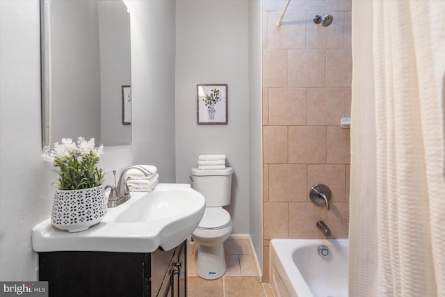 bathroom with tile patterned flooring, toilet, shower / tub combo, vanity, and baseboards