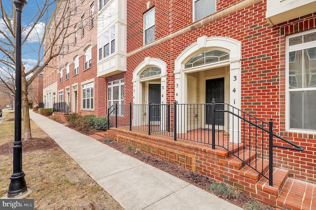 entrance to property with brick siding