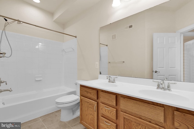 full bathroom with double vanity, a sink, visible vents, and tile patterned floors