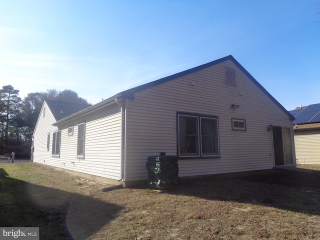 view of property exterior featuring a yard