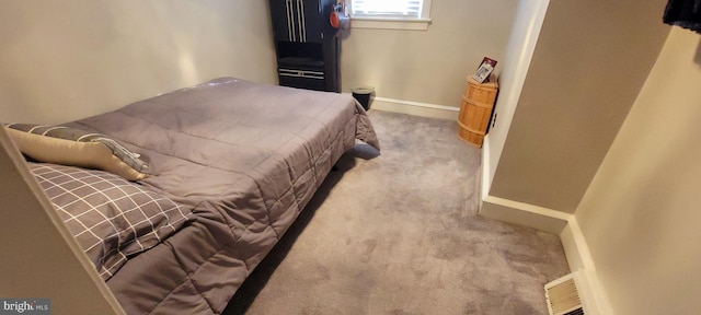 bedroom featuring light colored carpet, visible vents, and baseboards