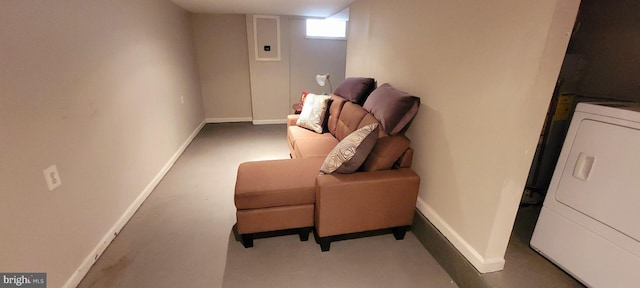 living area with washer / clothes dryer, carpet, and baseboards